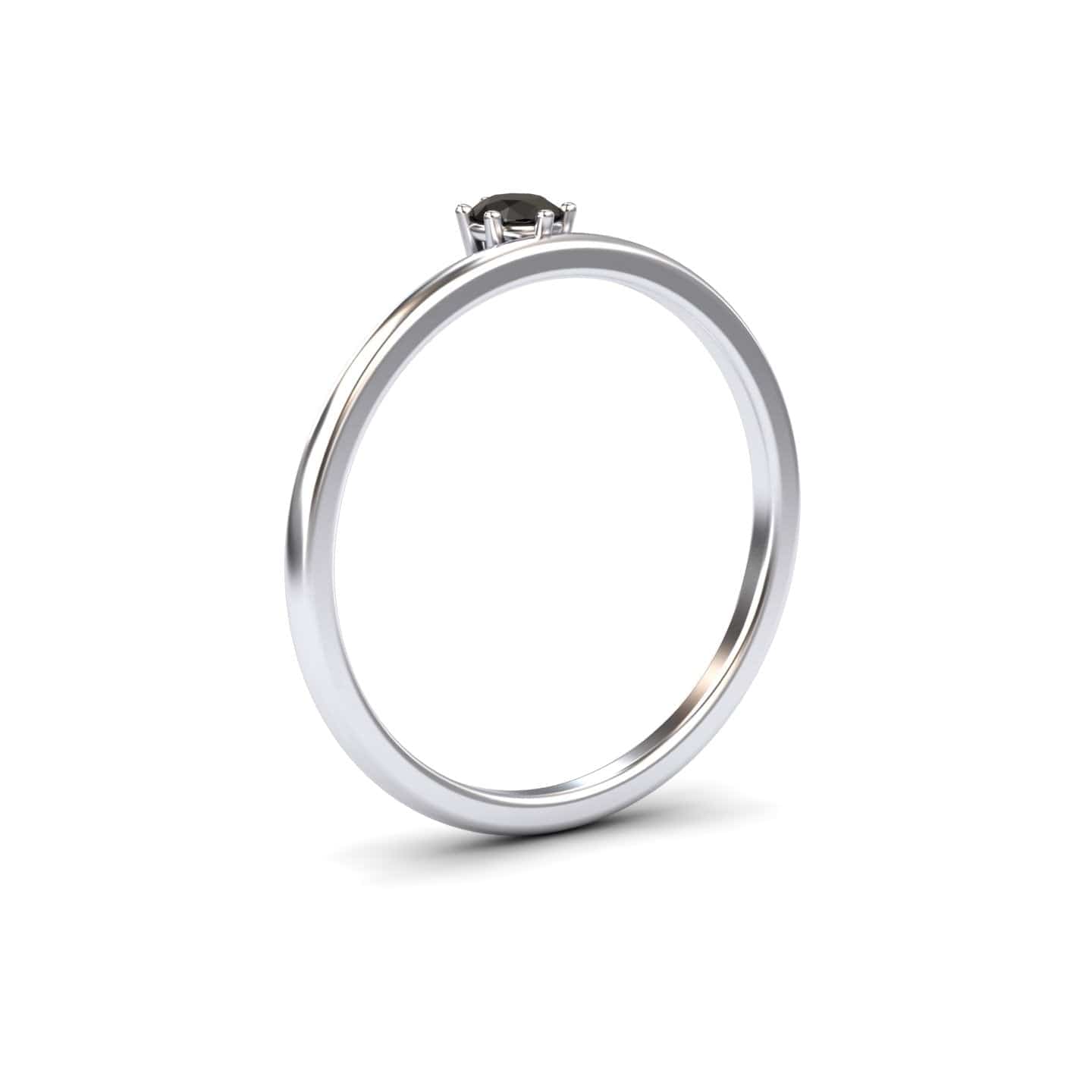 The Black Diamond Solitaire Petite Ring - Faria features a simple silver band with a single round black diamond in a minimalist prong setting, shown against a plain white background.