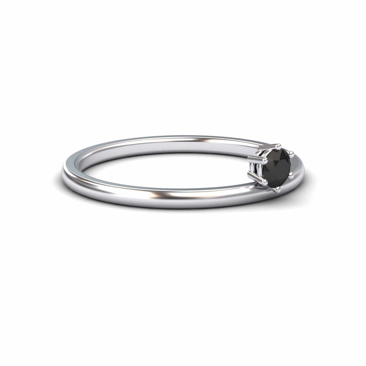 The Black Diamond Solitaire Petite Ring - Faria is a minimalist silver ring with a single round black diamond in a prong setting, shown on a plain white background.
