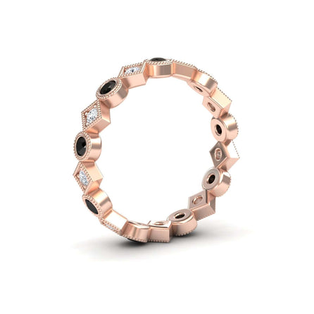The Black & White Diamond Geometric Eternity Band - Hetal features alternating round black stones and small white diamonds in hexagonal and circular patterns, shown standing upright on a white background.