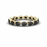 The Black Diamond Stackable Eternity Band - Kalyani features alternating marquise-shaped black stones set in a continuous gold band, shown on a white background.