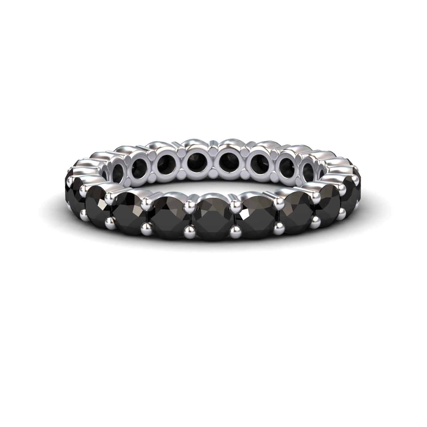 The Black Diamond Prong-Set Eternity Band - Mahira features round black stones set all around its silver band, shown against a white background.