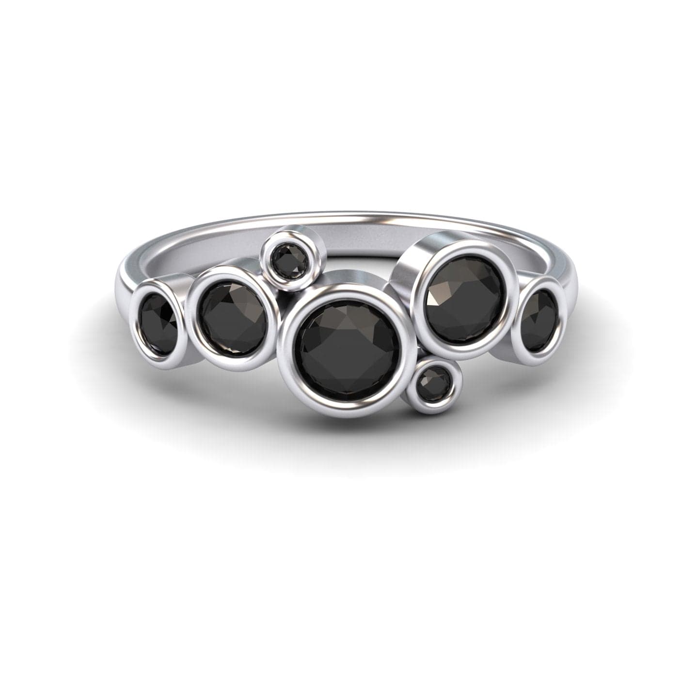The Black Diamond Bubble Ring - Carmen features seven round black diamonds in varying sizes, each set in a bezel and arranged in an asymmetrical, clustered design.
