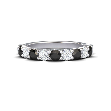 The Parveen Black & White Diamond Half Eternity Wedding Ring features alternating round black and white diamonds set in a continuous silver band.
