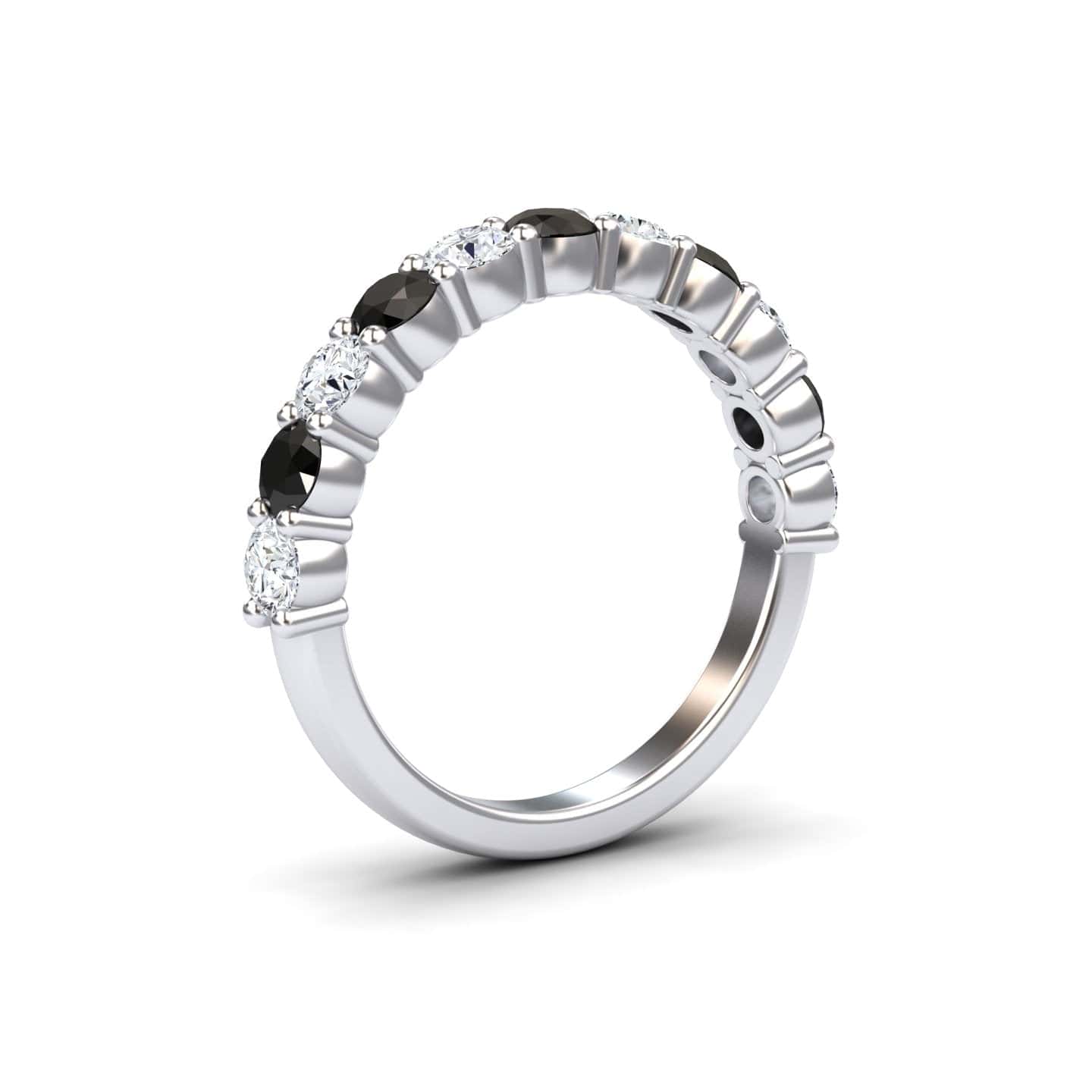 The Black & White Diamond Half Eternity Wedding Ring - Parveen is a silver band with alternating round black and white diamonds set along the upper half, shown on a plain white background.