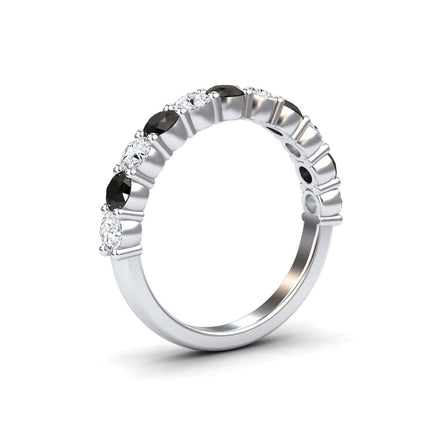 The Black & White Diamond Half Eternity Wedding Ring - Parveen is a silver band with alternating round black and white diamonds set along the upper half, shown on a plain white background.