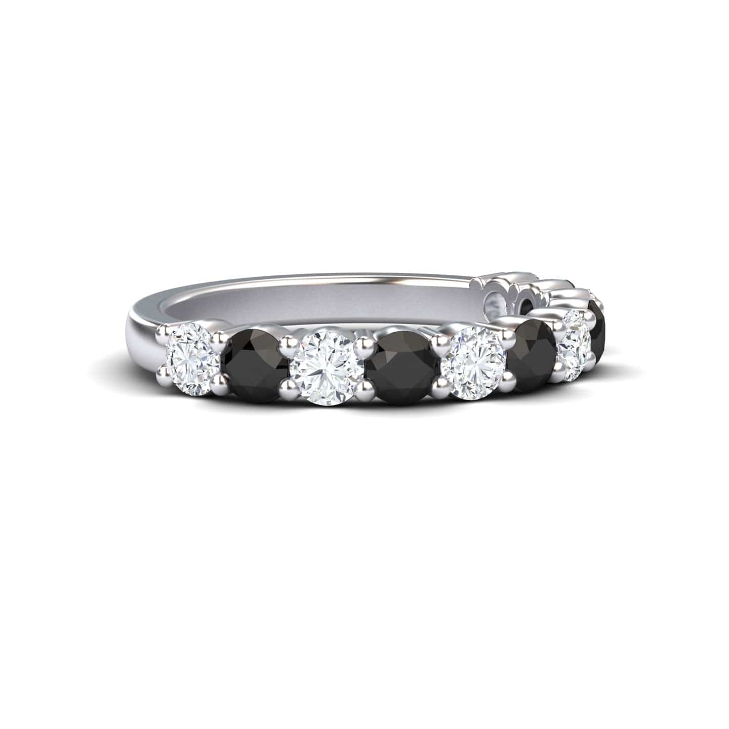The Black & White Diamond Half Eternity Wedding Ring - Parveen features alternating round black and white diamonds set in a silver band, displayed on a white background.