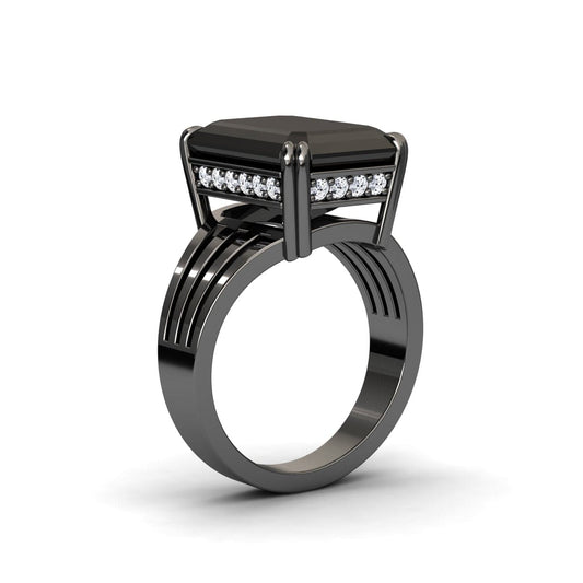 The Black & White Diamond Fashion Solitaire Ring - Tasmia features a sleek black band with a large geometric black stone in a prong setting, accented by white diamonds beneath and a modern layered design.