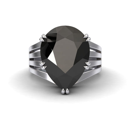 The Black & White Diamond Regal Ring - Anna features a large pear-shaped black gemstone set in a modern split-shank silver band, displayed on a white background.