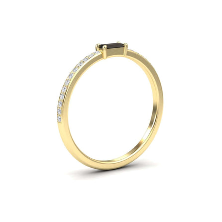 The Black & White Diamond Pave Ring - Dia is a slim gold band with small diamonds on the band and a rectangular black stone in a four-prong setting, shown on a white background.