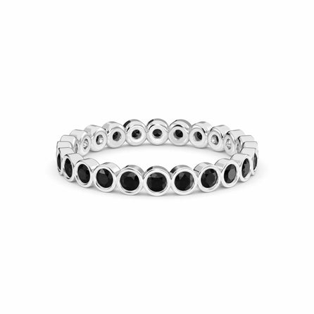 The Black Diamond Bezel Set Eternity Band Ring - Zara features evenly spaced round black stones in bezel settings encircling the silver band, shown on a white background.