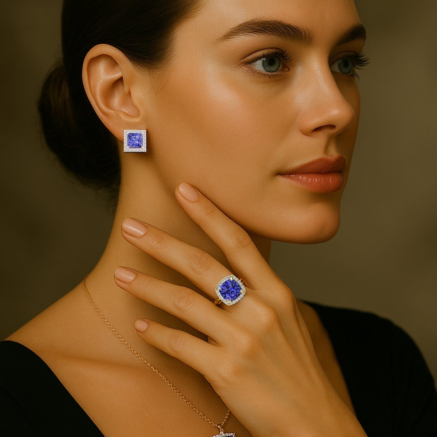 Woman wearing a tanzanite blue gemstone ring and earring with a neutral background