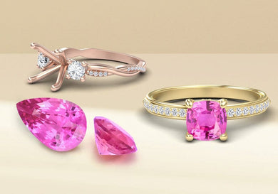 Two gold rings with pink sapphire gemstones on a beige background