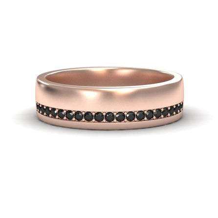 The Mens Black Diamond Channel-Set Wedding Band - Yan is a rose gold ring with a matte finish, featuring a single row of small, round black diamonds set around the center.