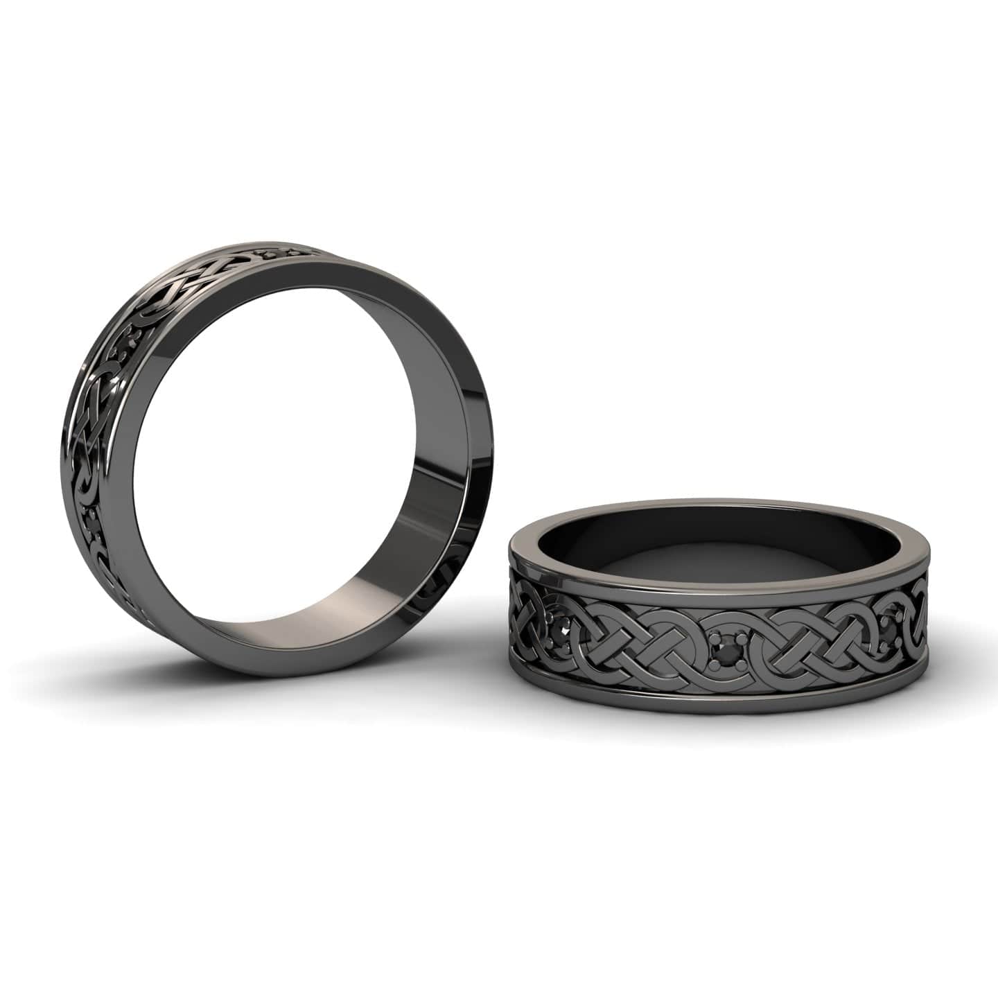 The Black Diamond Celtic Knot Wedding Band - Li Mei is shown in black with intricate knot patterns, one ring upright and one lying flat on a white background. Both feature a polished, reflective finish.
