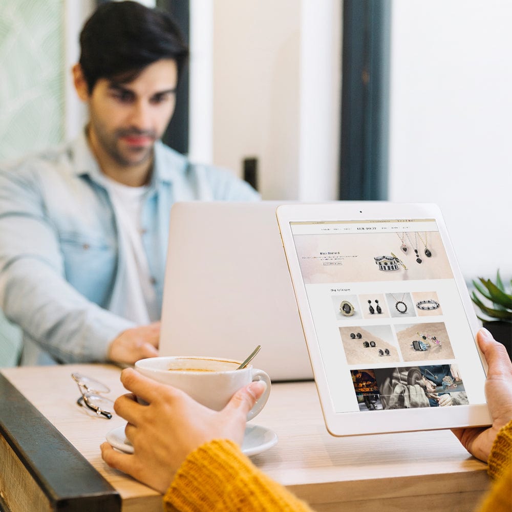 Man as Consult Our Specialist with tab with truesanity website