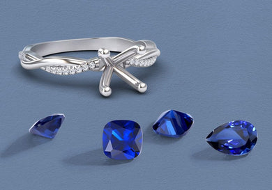 Silver ring with blue gemstones on a blue background