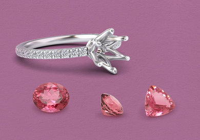 Silver ring with pink gemstones on a purple background