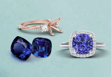 Jewelry set with a ring, earrings, and tanzanite blue gemstones on a light blue background