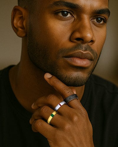 Man with rings on his fingers against a neutral background