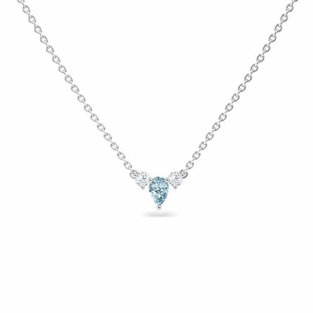 The Aquamarine & Diamond Three-Stone Necklace - Jina features a delicate silver chain with a central blue heart-shaped gemstone and two round clear stones, shown on a white background.