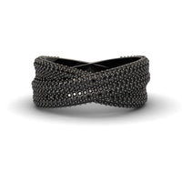 The Black Diamond Pave Crossover Statement Ring - Noor features a crisscrossed black design with textured, raised bead details for a modern, intricate look.