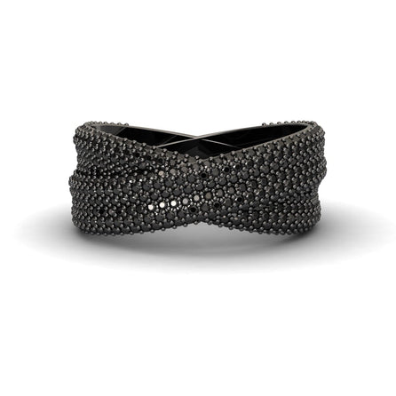 The Black Diamond Pave Crossover Statement Ring - Noor features a crisscrossed black design with textured, raised bead details for a modern, intricate look.
