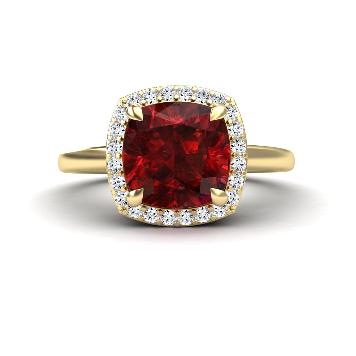 Lab grown ruby and diamond halo ring in yellow gold