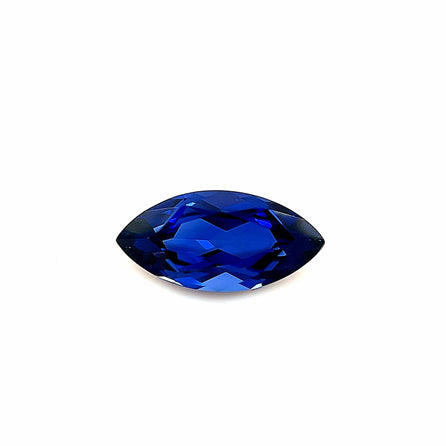 The 10x5 Exceptional Marquise Lab Created Blue Sapphire features multiple facets and is shown against a plain white background.