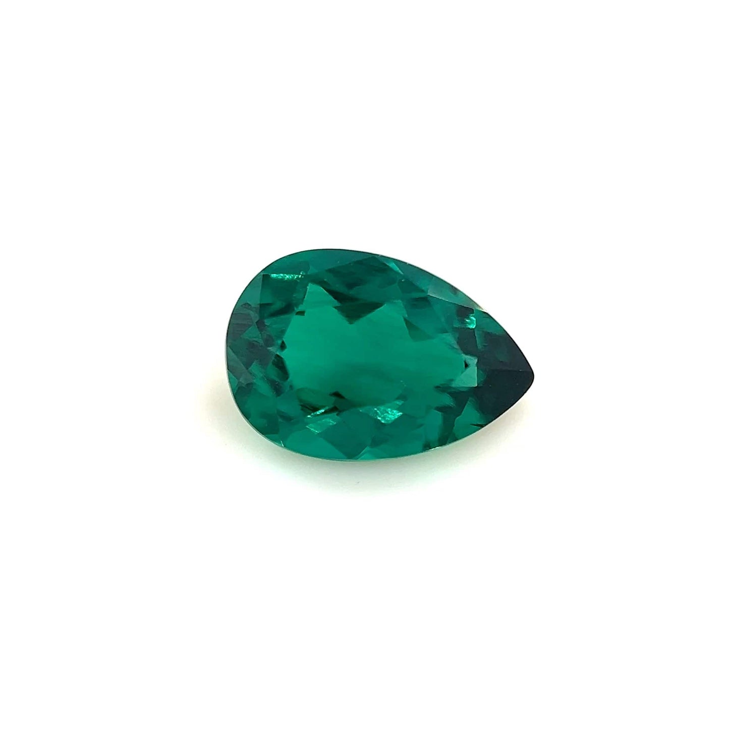 The 9.0x6.0 Exceptional Pear Zambian Color Lab Created Emerald, with vibrant translucent green color, is displayed against a plain white background.