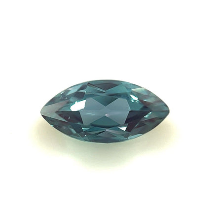 An 8.0x4.0 Exceptional Marquise Lab Created Alexandrite with a faceted, shiny surface is displayed on a plain white background.