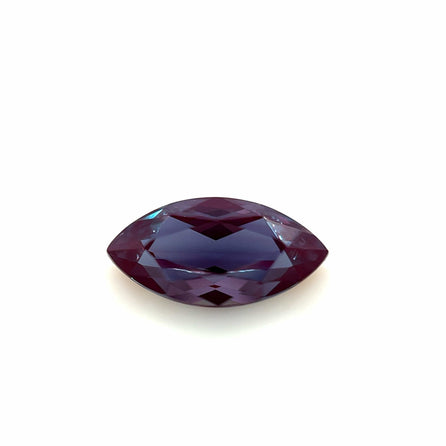 The 10.0x5.0 Exceptional Marquise Lab Created Alexandrite features a deep purple, faceted gemstone displayed on a white background.