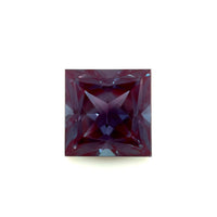 The 10mm Exceptional Square Princess Lab Created Alexandrite features a deep purple hue and intricate facets that reflect light in geometric patterns, set against a plain white background.