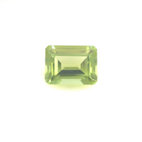 The 8.0x6.0 Premium Emerald Peridot features a natural rectangular cut with sharp facets, displayed against a plain white background.