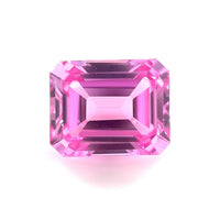 The 10x8 Exceptional Emerald Lab Created Medium Pink Sapphire features sharp facets and a bright, reflective surface, displayed from above on a white background.