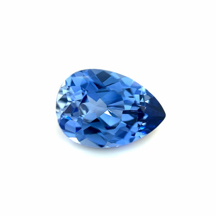 The 10.0x7.0 Exceptional Pear Lab Created Light Blue Sapphire is showcased against a white background, highlighting its vibrant color and sparkling reflections.