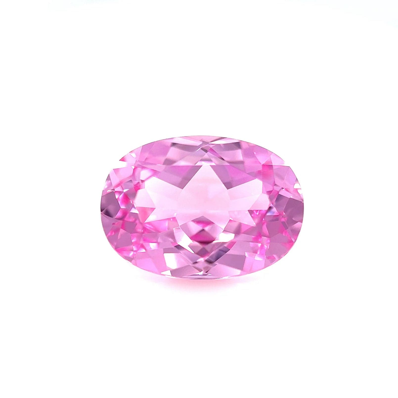 The 14.0x10.0 Exceptional Emerald Lab Created Medium Pink Sapphire is showcased against a plain white background, emphasizing its vibrant medium pink color and sparkling reflective surfaces.
