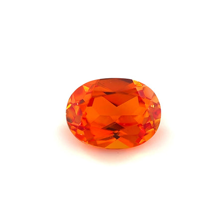 An 8.0x6.0 exceptional oval lab created orange sapphire is displayed against a plain white background.