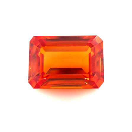 The 14.0x10.0 Exceptional Emerald Lab Created Orange Sapphire features a rectangular, faceted shape with beveled edges and is shown against a plain white background.