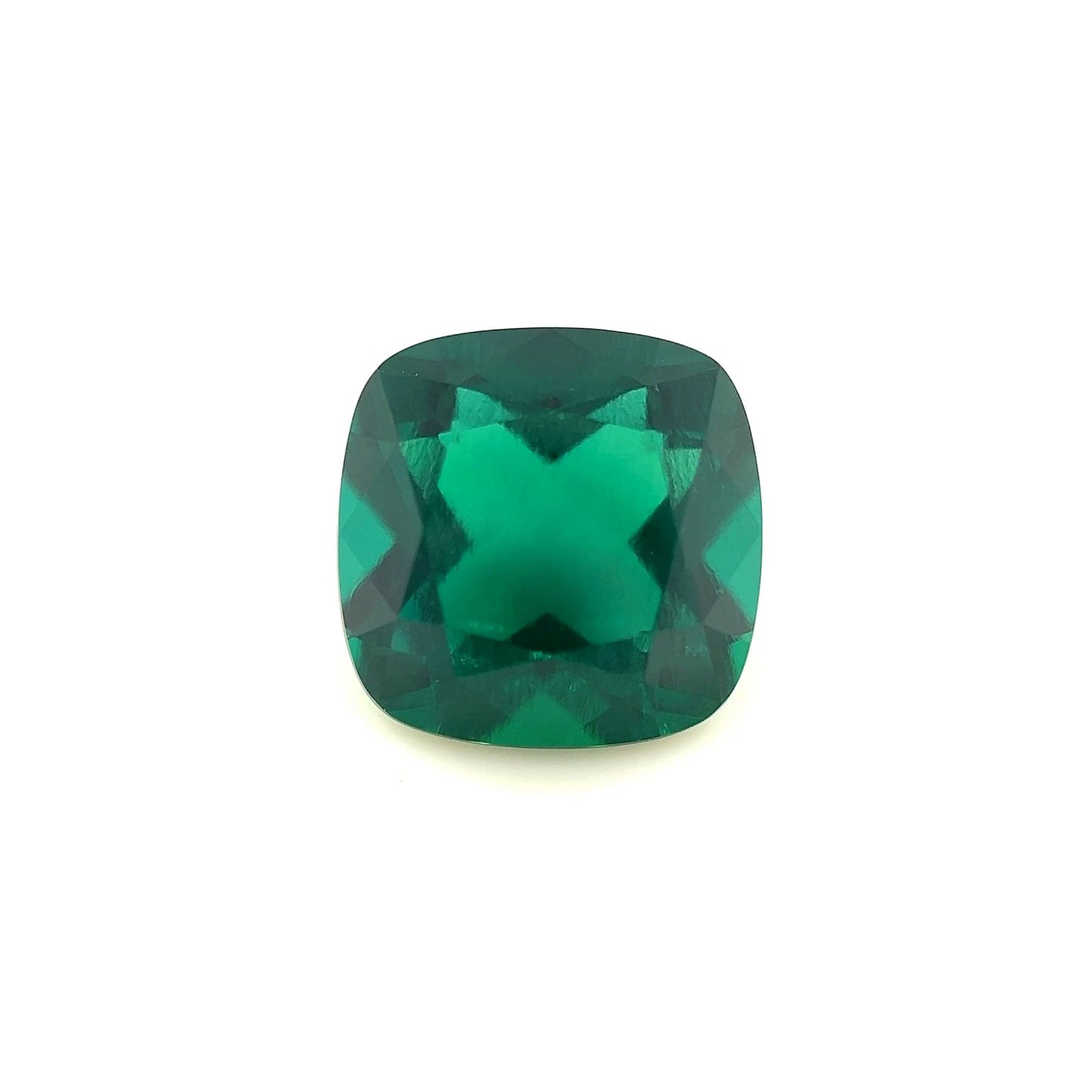 An 11mm Exceptional Cushion Zambian Color Lab Created Emerald is displayed on a plain white background.