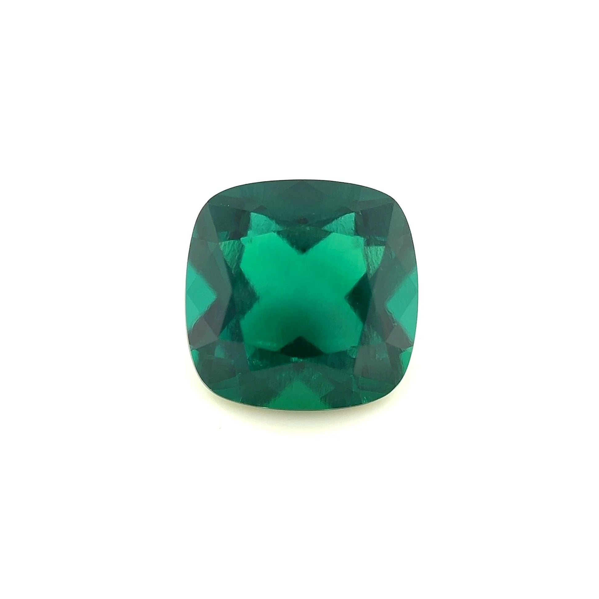 An 11mm Exceptional Cushion Zambian Color Lab Created Emerald is displayed on a plain white background.