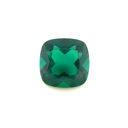 An 11mm Exceptional Cushion Zambian Color Lab Created Emerald is displayed on a plain white background.