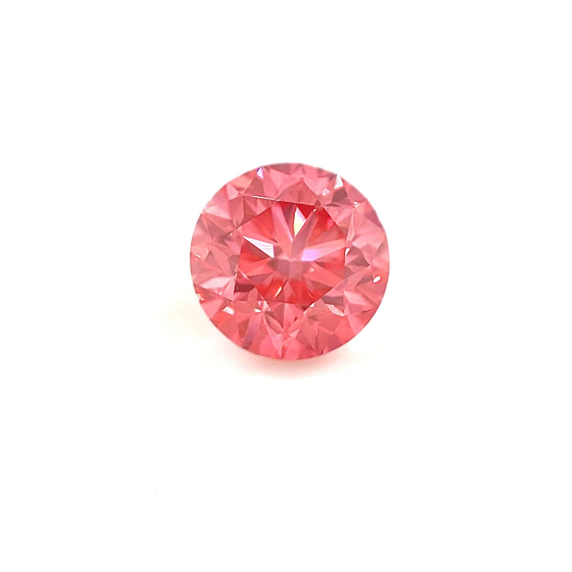 The 1.50 Carats Round 7mm Premium Rose Pink Diamond is displayed on a white background, highlighting its dazzling brilliance and precise, symmetrical cut.