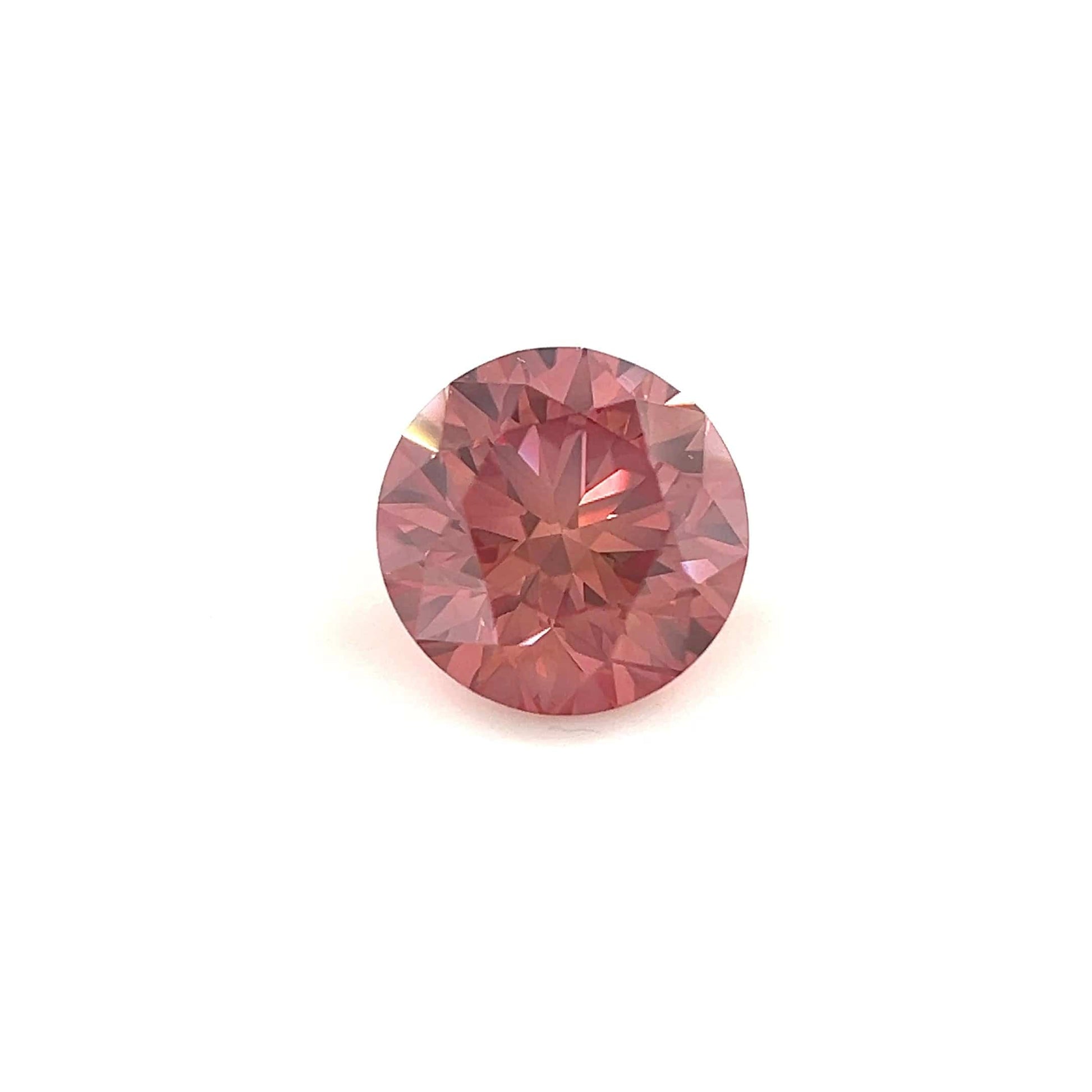 A 1.08 carat round, 6.5mm premium rose pink diamond is displayed against a plain white background, highlighting its sparkling surface and intricate cuts.