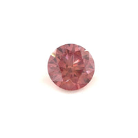 A 1.08 carat round, 6.5mm premium rose pink diamond is displayed against a plain white background, highlighting its sparkling surface and intricate cuts.