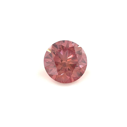 A 1.08 carat round, 6.5mm premium rose pink diamond is displayed against a plain white background, highlighting its sparkling surface and intricate cuts.