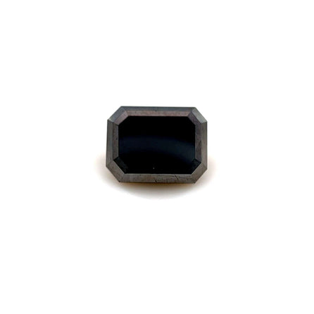 The 2.10 carats Emerald 8.0x6.1 Premium Black Diamond, featuring beveled faceted edges, is showcased centered on a white background, highlighting the allure of this natural gemstone.