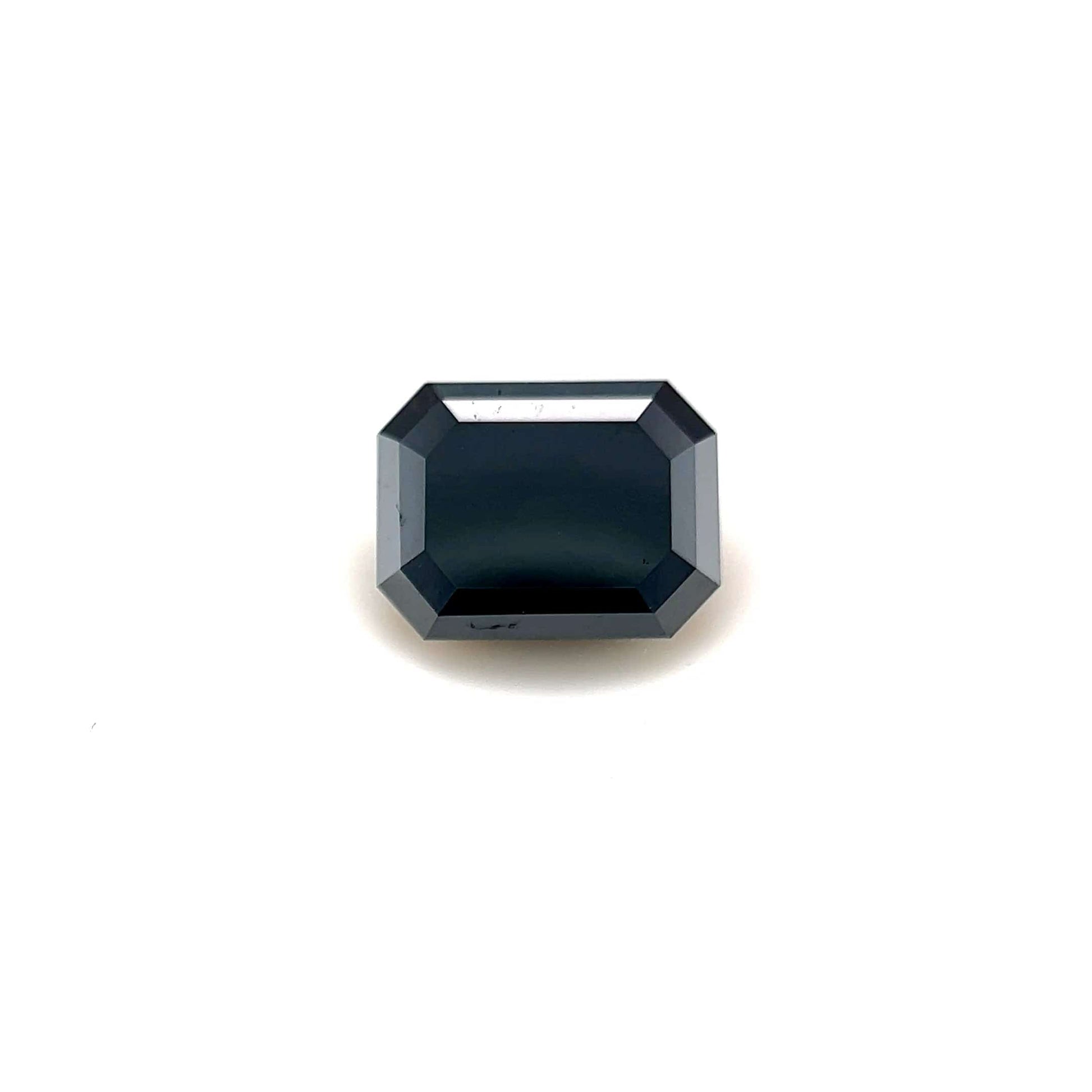 A 2.08 carat Emerald7.97x6.06 Premium Black Diamond with reflective facets is displayed on a plain white background, highlighting its striking emerald shape.