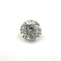 The 6.81 x 6.81 x 4.29 Fine Salt & Pepper Diamond, round brilliant cut, is showcased on a plain white background, highlighting its unique inclusions, sparkling clarity, and intricate reflective surfaces.