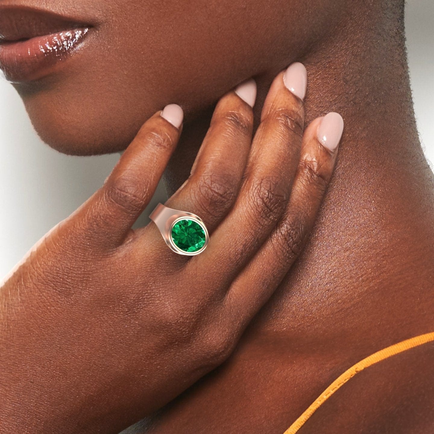 4.59-carat Lab Grown Emerald Bezel Set Solitaire Ring in 14K Rose gold, Ada style, hand view