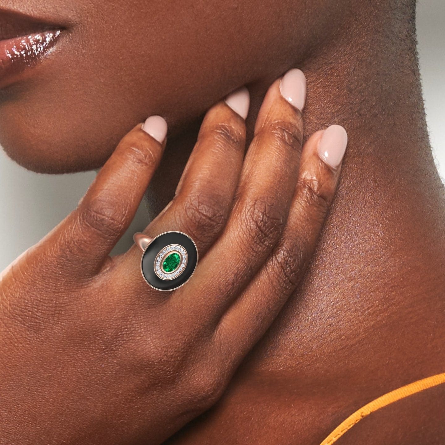 0.48-carat Emerald & Diamond Black Enamel Halo Ring in 14K rose gold, Camille style, hand view